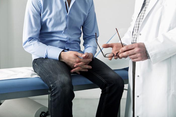 man talking to a doctor