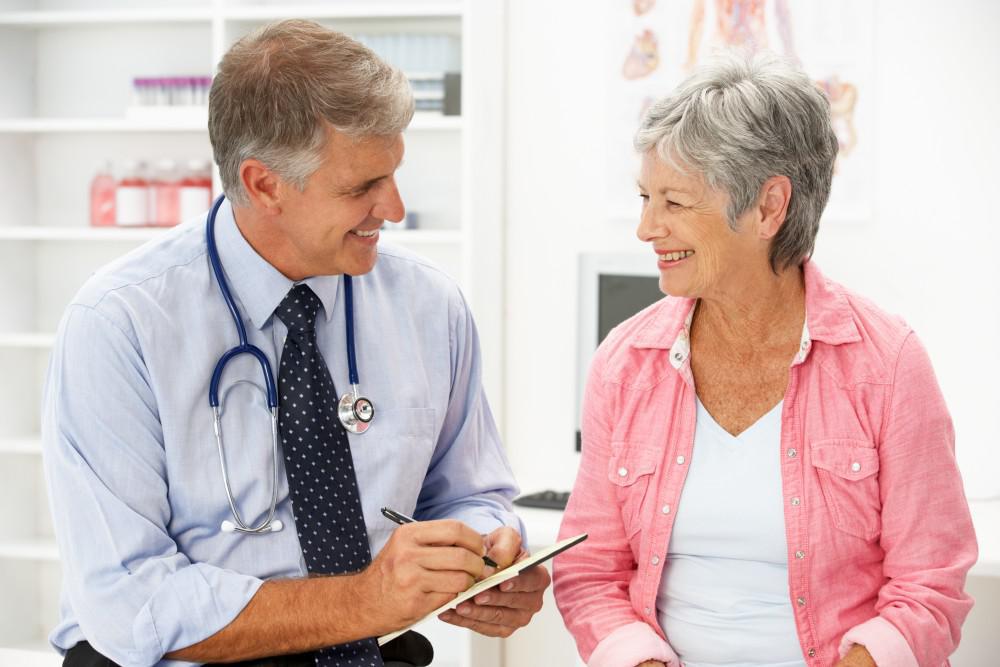 A doctor talking to a female patient