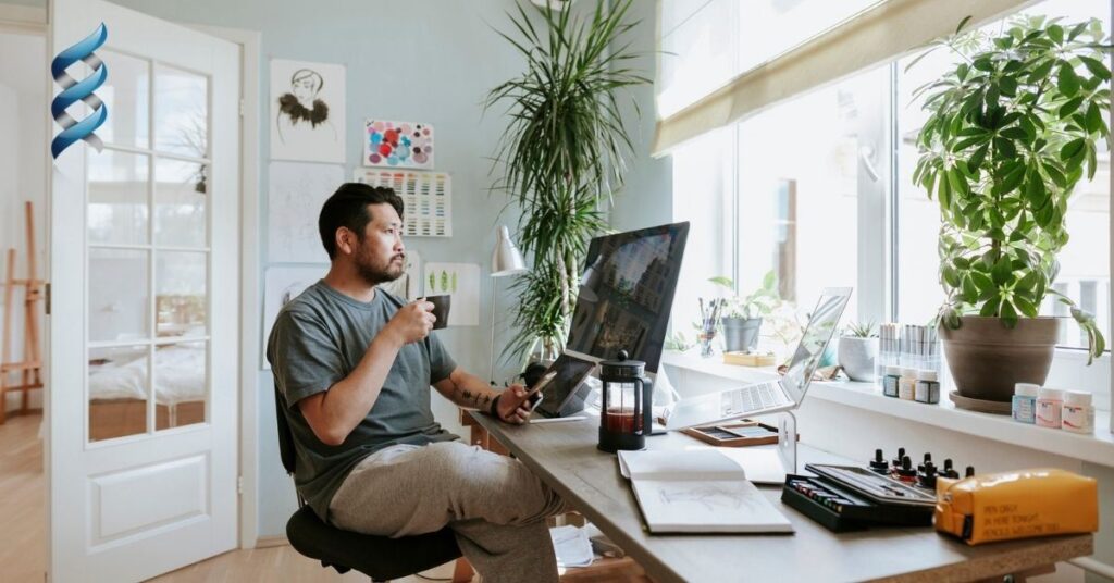 A man sitting at his desk, working from home