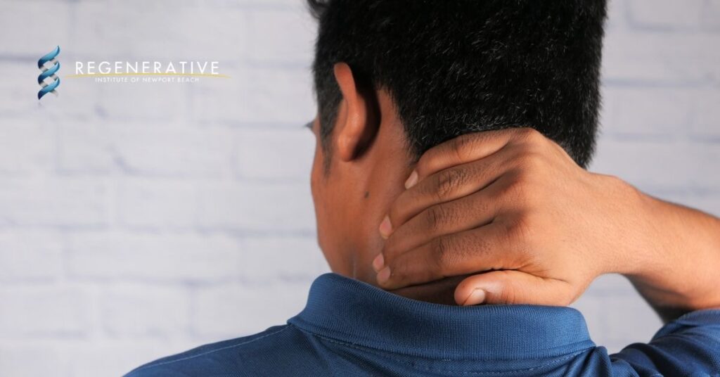 a man holding neck in pain