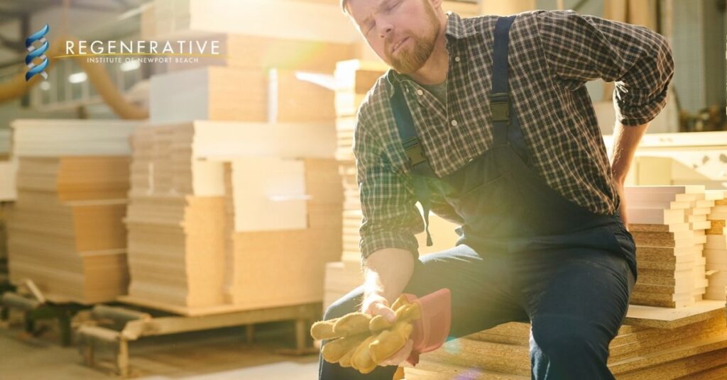 A carpenter working in pain